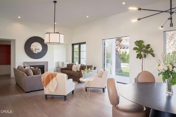 Dining room, Fireplace, Interior, Living room, Pendant Lights, Recessed Lighting, Wood Texture Flooring