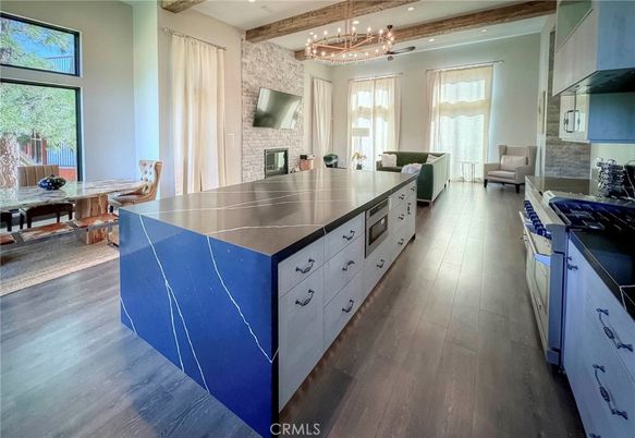 Chandelier, Dining room, Fireplace, Interior, Kitchen, Living room, Recessed Lighting, Stone Walls, Wooden Beams, Wood Texture Flooring