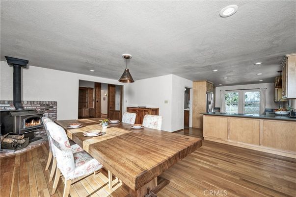 Dining room, Fireplace, Interior, Pendant Lights, Recessed Lighting, Wood Texture Flooring