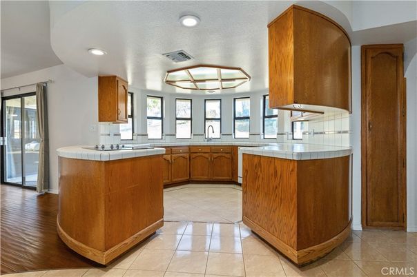 Interior, Kitchen, Recessed Lighting, Tile Countertops, Wood Texture Flooring