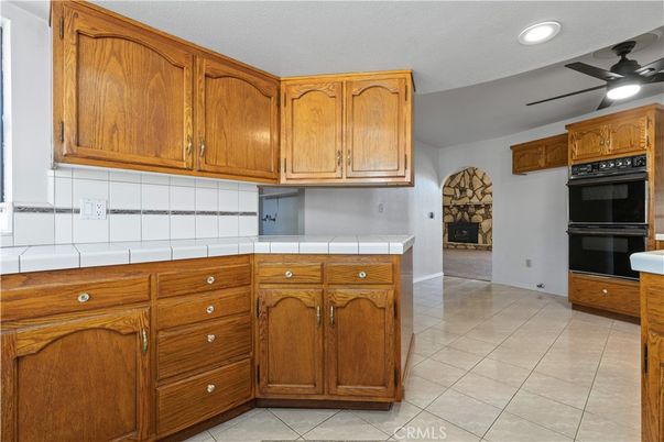 Fireplace, Interior, Kitchen, Recessed Lighting, Tile Countertops