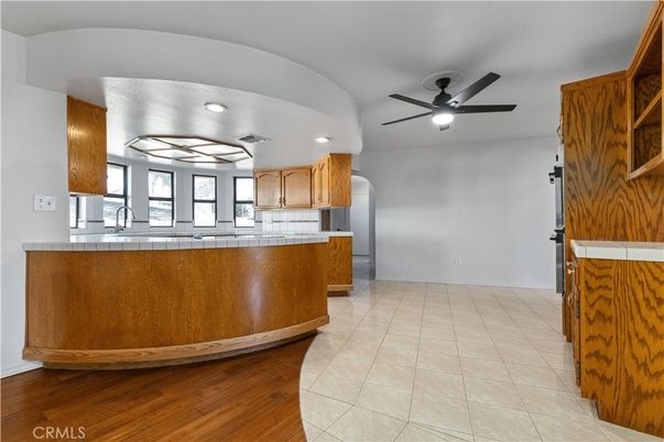 Interior, Kitchen, Recessed Lighting, Tile Countertops, Wood Texture Flooring