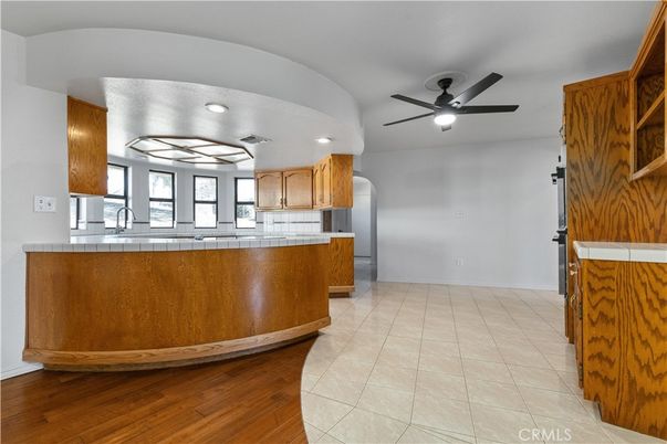 Interior, Kitchen, Recessed Lighting, Tile Countertops, Wood Texture Flooring