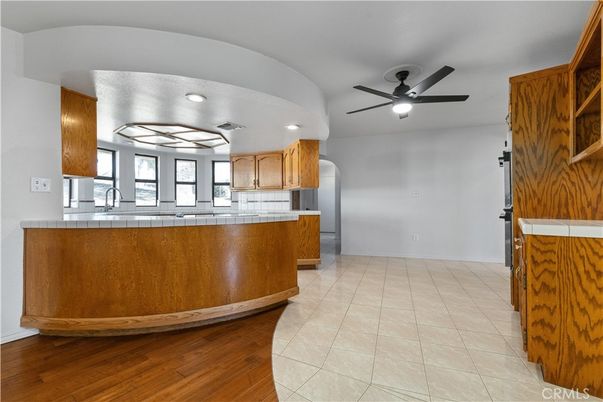 Interior, Kitchen, Recessed Lighting, Tile Countertops, Wood Texture Flooring
