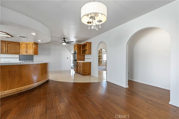 Interior, Kitchen, Recessed Lighting, Tile Countertops, Wood Texture Flooring