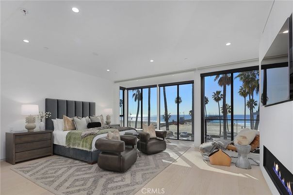 Bedroom, Fireplace, Interior, Recessed Lighting, Water, Wood Texture Flooring