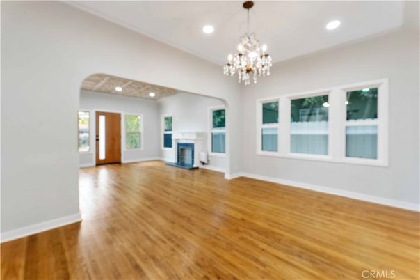 Chandelier, Empty room, Fireplace, Interior, Recessed Lighting, Wood Texture Flooring