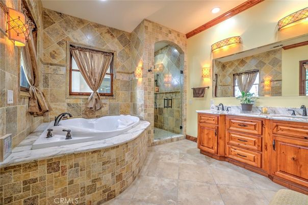 Bathroom, Dual Sink Vanities, Glass Shower, Interior, Recessed Lighting, Stone Walls