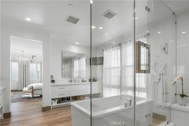 Bathroom, Bedroom, Chandelier, Dual Sink Vanities, Glass Shower, Interior, Pendant Lights, Recessed Lighting, Wood Texture Flooring