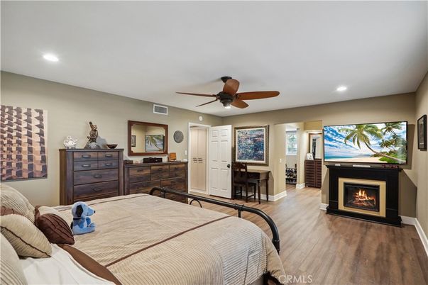 Bedroom, Fireplace, Interior, Recessed Lighting, Wood Texture Flooring