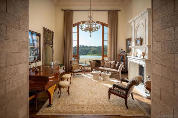 Chandelier, Fireplace, Interior, Living room, Piano, Stone Walls, Wood Texture Flooring