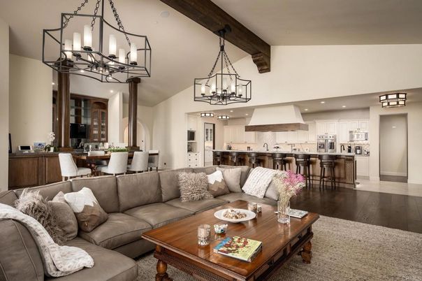 Chandelier, Dining room, Interior, Kitchen, Living room, Pendant Lights, Recessed Lighting, Stainless Steel Appliances, Wooden Beams, Wood Texture Flooring