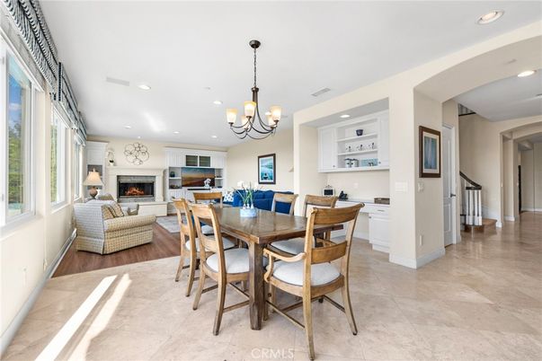 Chandelier, Dining room, Fireplace, Interior, Living room, Recessed Lighting, Wood Texture Flooring