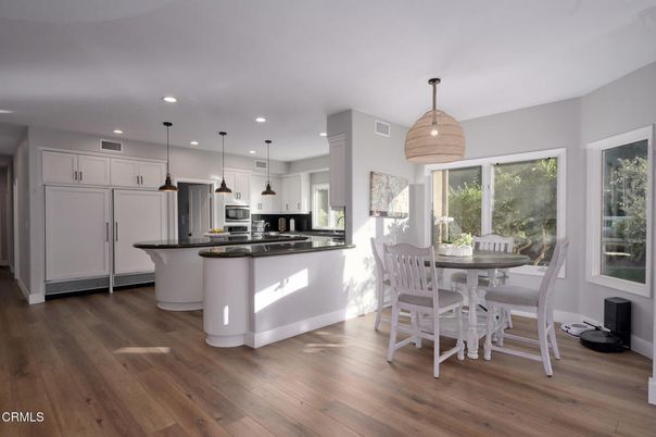 Dining room, Interior, Kitchen, Pendant Lights, Recessed Lighting, Stainless Steel Appliances, Wood Texture Flooring