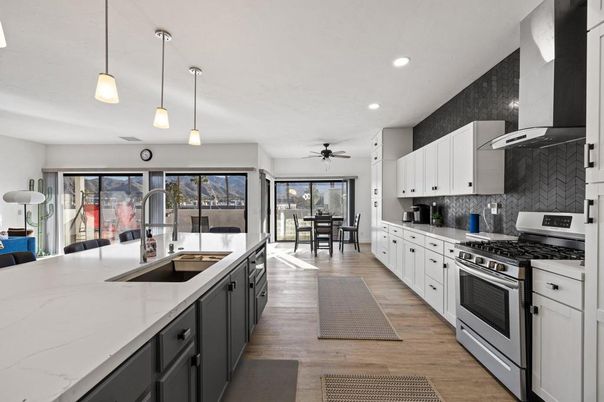 Dining room, Interior, Kitchen, Pendant Lights, Recessed Lighting, Stainless Steel Appliances, Wood Texture Flooring