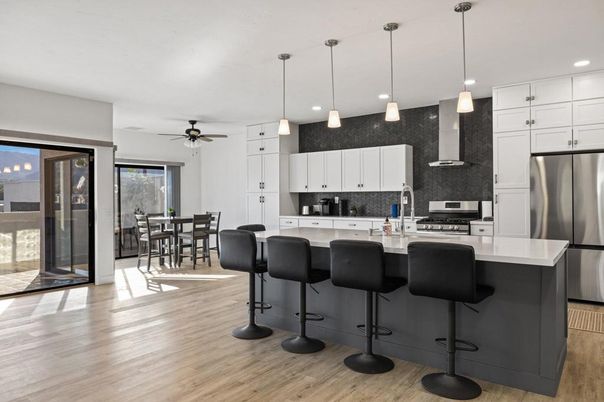 Dining room, Interior, Kitchen, Pendant Lights, Recessed Lighting, Stainless Steel Appliances, Wood Texture Flooring