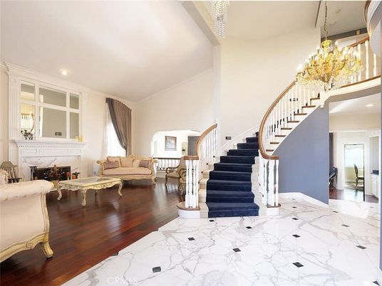 Chandelier, Fireplace, Interior, Marble, Recessed Lighting, Wood Texture Flooring