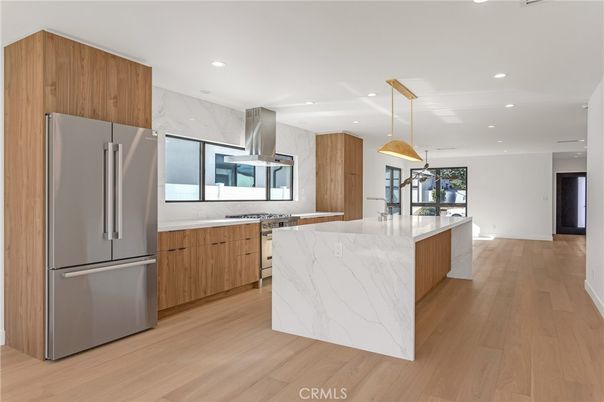 Interior, Kitchen, Marble Walls, Pendant Lights, Recessed Lighting, Stainless Steel Appliances, Wood Texture Flooring
