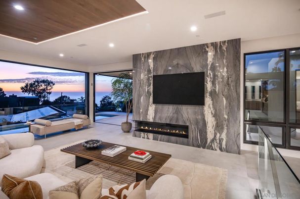 Fireplace, Interior, Living room, Marble Walls, Recessed Lighting, Water, Wooden Ceilings