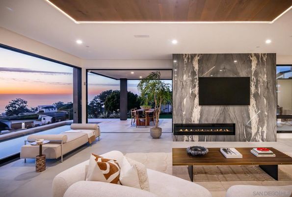 Fireplace, Interior, Living room, Marble Walls, Recessed Lighting, Water, Wooden Ceilings