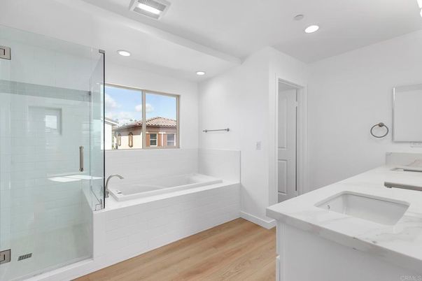 Bathroom, Dual Sink Vanities, Glass Shower, Interior, Recessed Lighting, Wood Texture Flooring