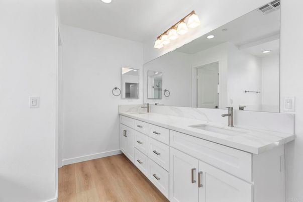 Bathroom, Dual Sink Vanities, Interior, Recessed Lighting, Wood Texture Flooring