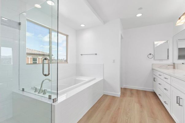 Bathroom, Dual Sink Vanities, Glass Shower, Interior, Recessed Lighting, Wood Texture Flooring