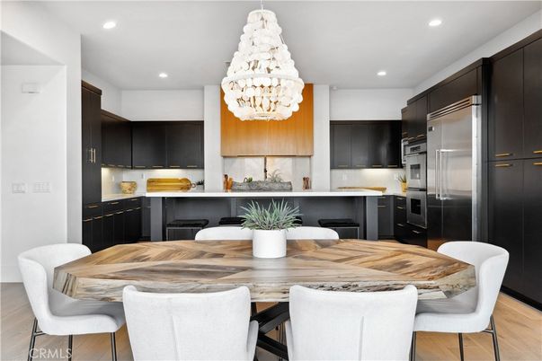 Chandelier, Dining room, Interior, Kitchen, Pendant Lights, Recessed Lighting, Stainless Steel Appliances, Wood Texture Flooring