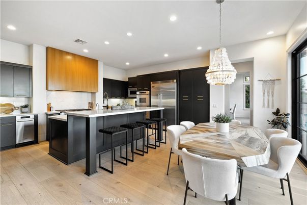 Chandelier, Dining room, Interior, Kitchen, Pendant Lights, Recessed Lighting, Stainless Steel Appliances, Wood Texture Flooring