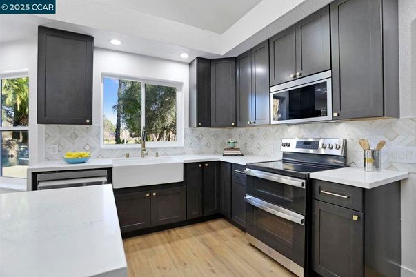 Interior, Kitchen, Recessed Lighting, Stainless Steel Appliances, Wood Texture Flooring