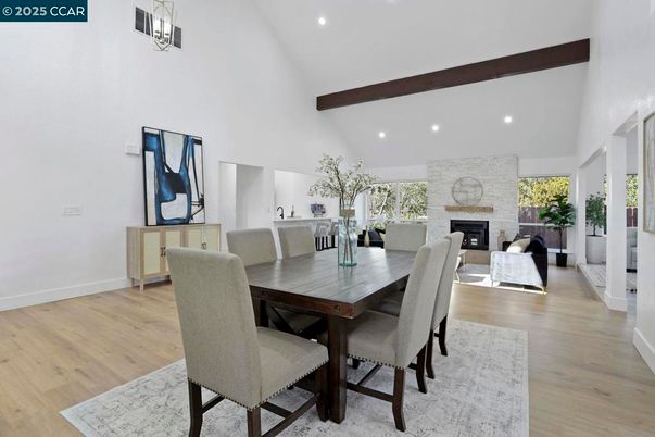 Dining room, Fireplace, Interior, Living room, Pendant Lights, Recessed Lighting, Stone Walls, Wooden Beams, Wood Texture Flooring