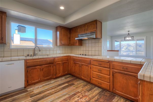 Interior, Kitchen, Pendant Lights, Recessed Lighting, Tile Countertops, Wood Texture Flooring