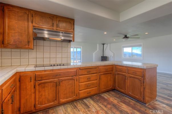 Interior, Kitchen, Recessed Lighting, Tile Countertops, Wood Texture Flooring
