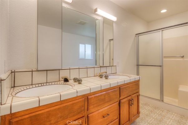 Bathroom, Dual Sink Vanities, Glass Shower, Interior, Recessed Lighting, Tile Countertops