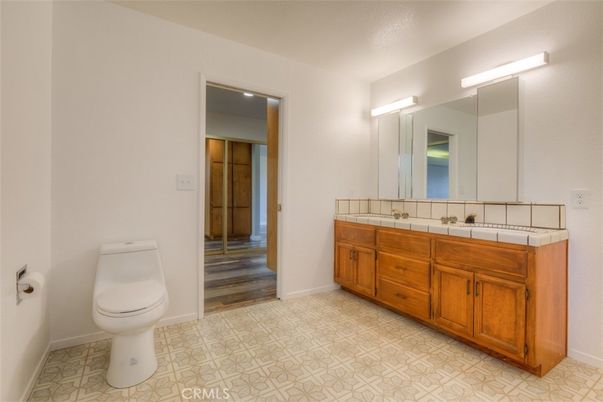 Bathroom, Dual Sink Vanities, Interior, Tile Countertops, Wood Texture Flooring