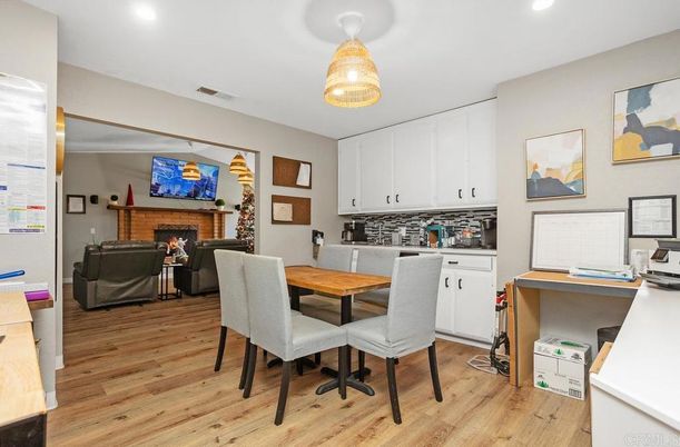 Dining room, Fireplace, Interior, Living room, Pendant Lights, Recessed Lighting, Wood Texture Flooring