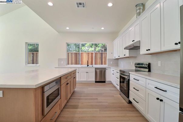 Interior, Kitchen, Recessed Lighting, Stainless Steel Appliances, Wood Texture Flooring