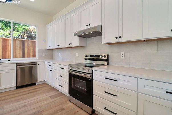 Interior, Kitchen, Recessed Lighting, Stainless Steel Appliances, Wood Texture Flooring