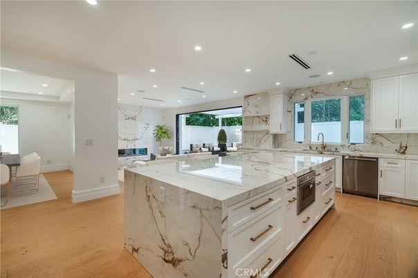 Interior, Kitchen, Marble Walls, Recessed Lighting, Stainless Steel Appliances, Wood Texture Flooring