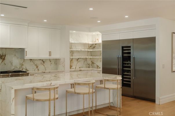 Interior, Kitchen, Marble Walls, Recessed Lighting, Stainless Steel Appliances, Wood Texture Flooring