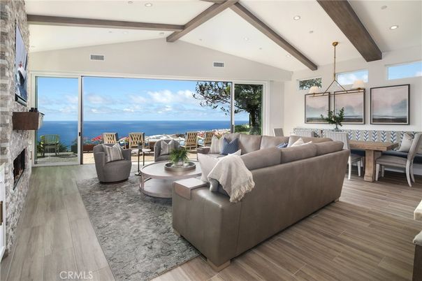 Dining room, Fireplace, Interior, Living room, Pendant Lights, Recessed Lighting, Stone Walls, Water, Wooden Beams, Wood Texture Flooring