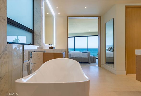 Bathroom, Free Standing Baths, Interior, Marble Walls, Recessed Lighting, Water, Wood Texture Flooring