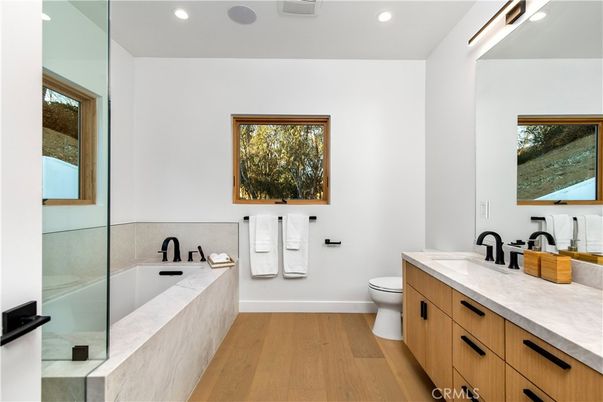 Bathroom, Dual Sink Vanities, Interior, Recessed Lighting, Wood Texture Flooring
