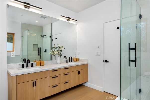 Bathroom, Dual Sink Vanities, Glass Shower, Interior, Recessed Lighting, Wood Texture Flooring