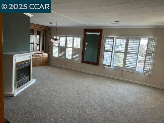Chandelier, Empty room, Fireplace, Interior