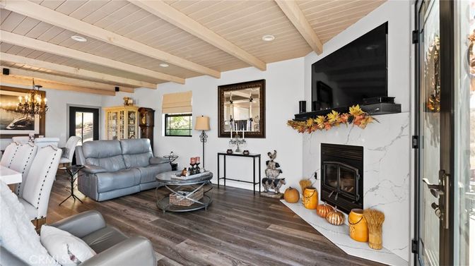 Chandelier, Dining room, Fireplace, Interior, Living room, Recessed Lighting, Wooden Beams, Wooden Ceilings, Wood Texture Flooring