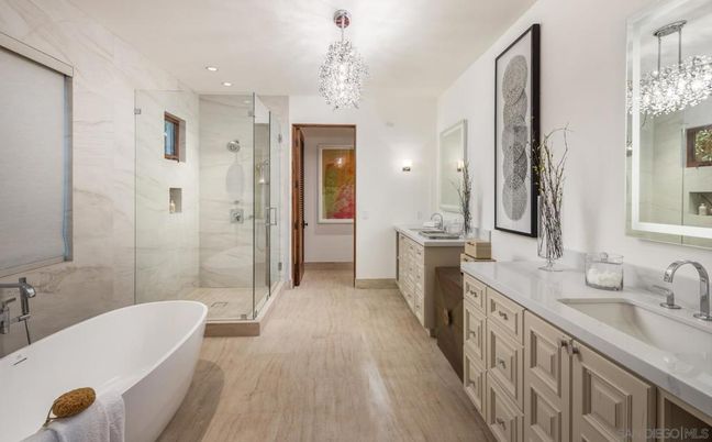 Bathroom, Chandelier, Dual Sink Vanities, Free Standing Baths, Glass Shower, Interior, Marble Walls, Recessed Lighting, Wood Texture Flooring