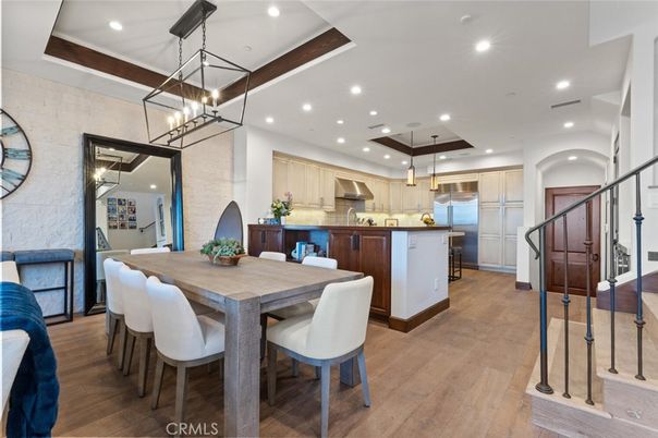 Chandelier, Dining room, Interior, Kitchen, Pendant Lights, Recessed Lighting, Stainless Steel Appliances, Wood Texture Flooring