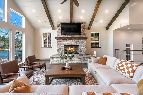 Fireplace, Interior, Living room, Recessed Lighting, Stone Walls, Water, Wooden Beams