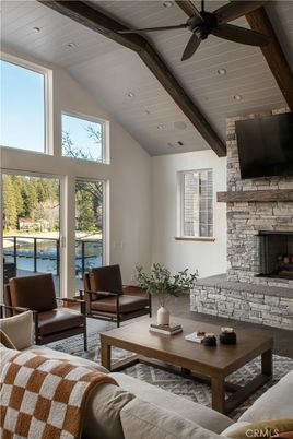Fireplace, Interior, Living room, Recessed Lighting, Stone Walls, Water, Wooden Beams